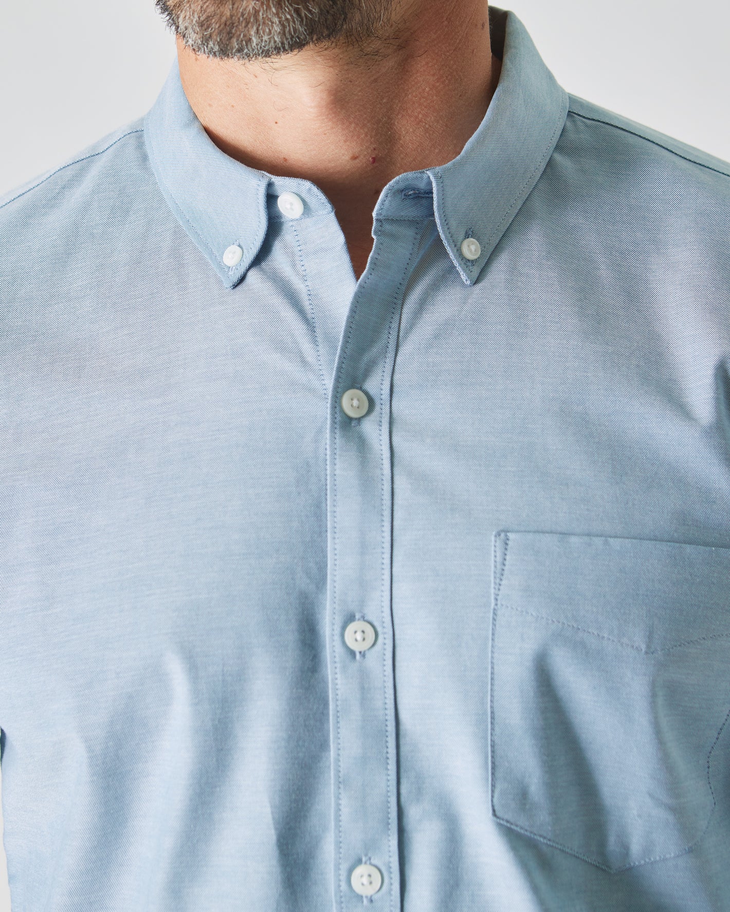 Harbor Stretch Oxford Long Sleeve Shirt close-up on man.