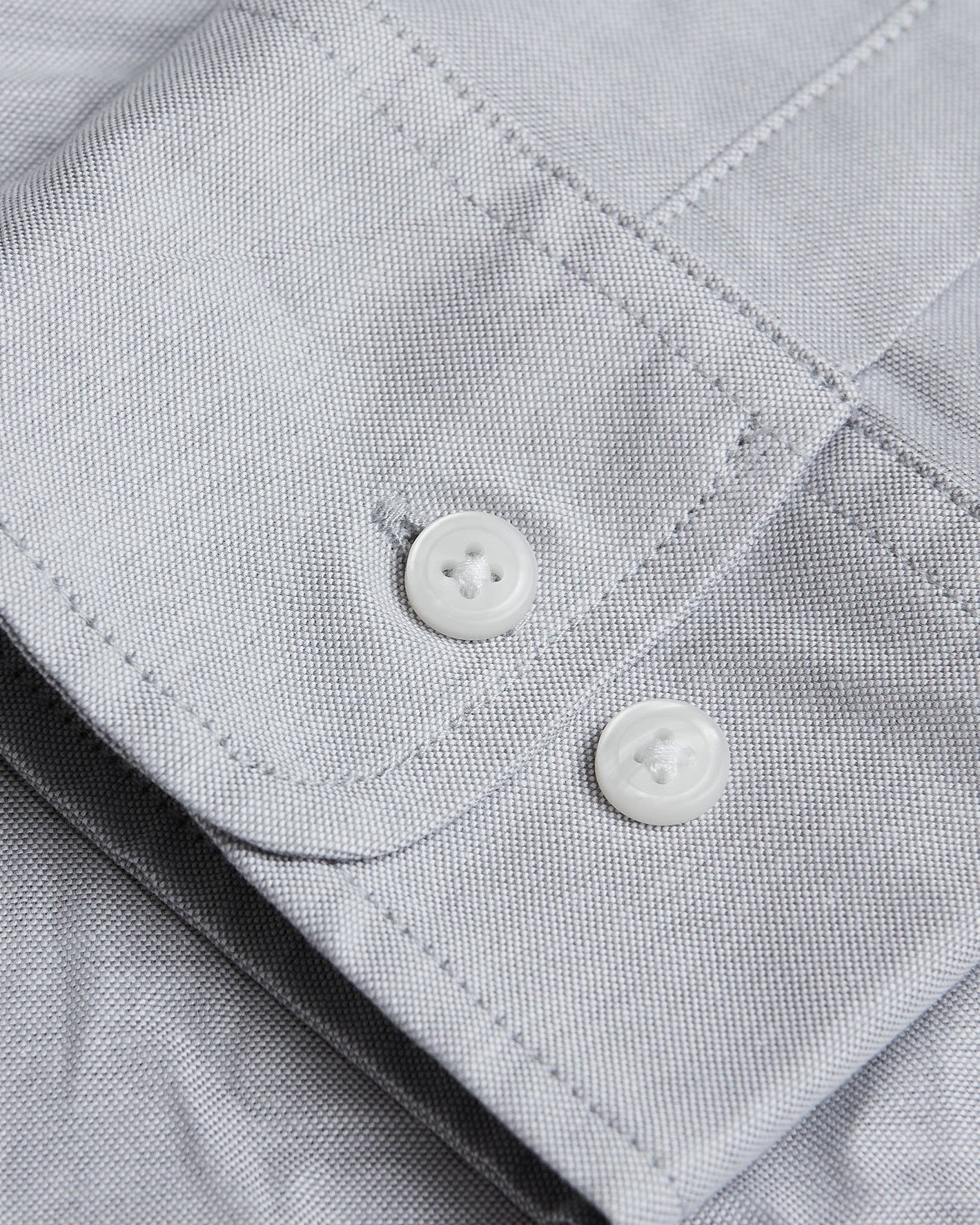 Light Gray Stretch Oxford Shirt cuff with buttons and fine texture.
