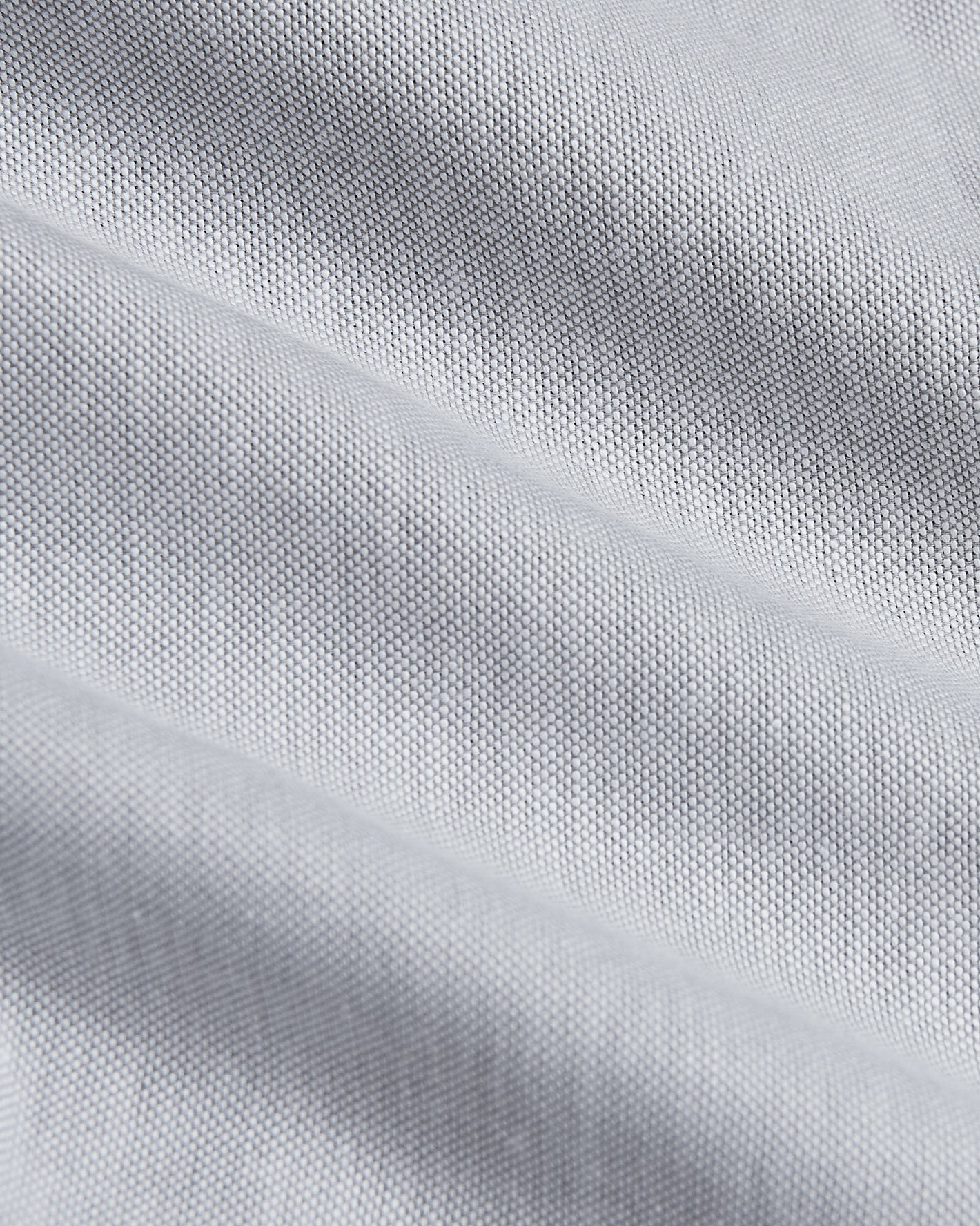 Light Gray Stretch Oxford Shirt, close-up of woven fabric texture.