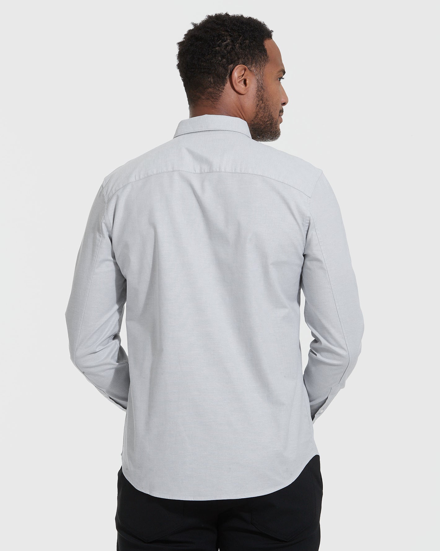 Man in Light Gray Stretch Oxford Long Sleeve Button Up Shirt.