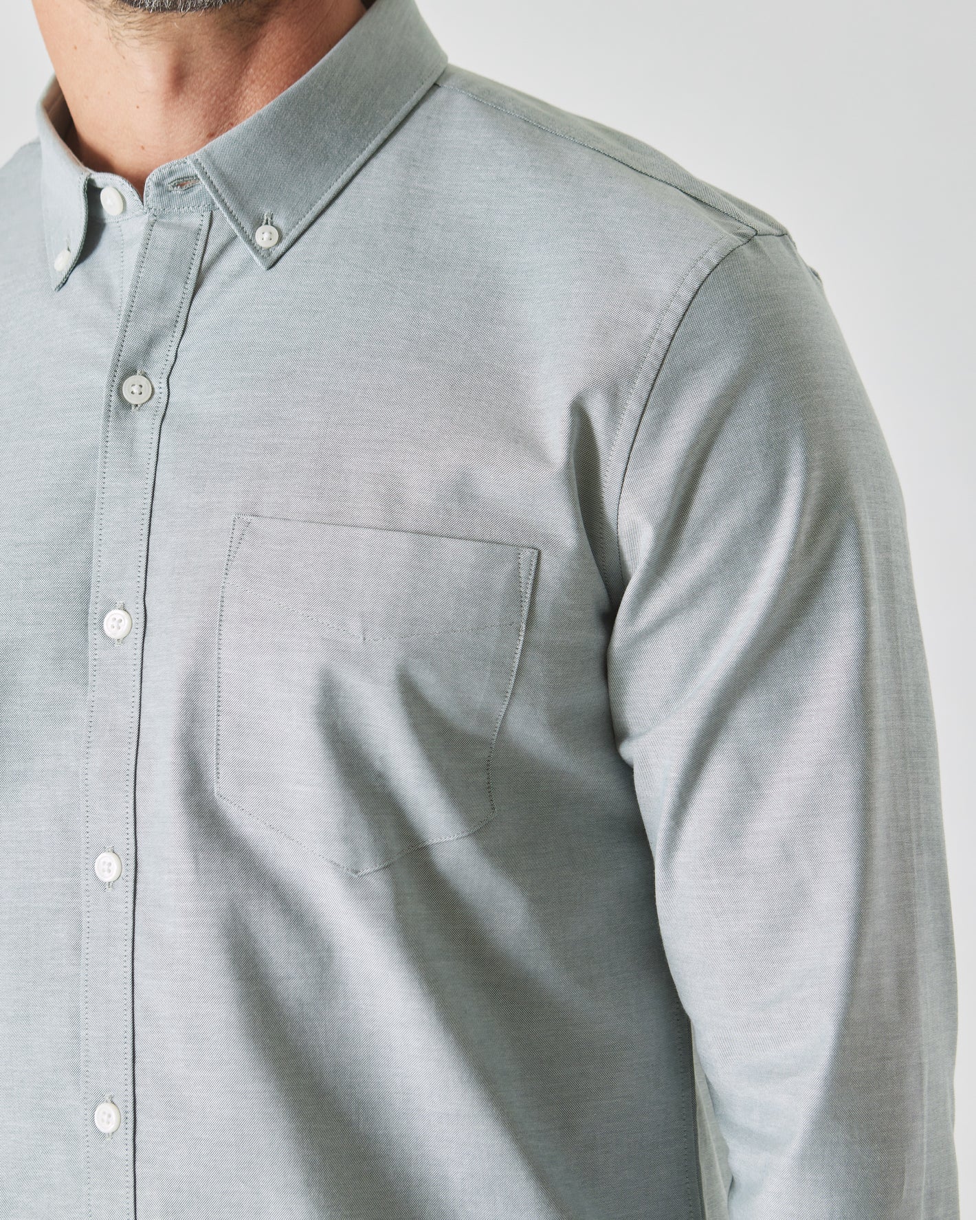 Moss Stretch Oxford Long Sleeve Shirt with button-down collar and chest pocket.