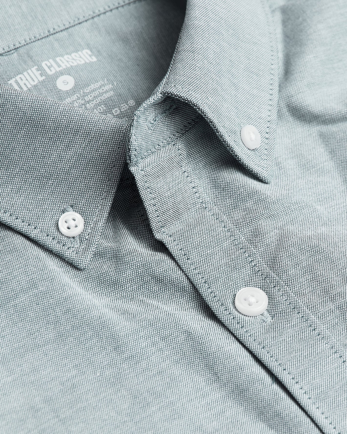 Moss Stretch Oxford Long Sleeve Shirt close-up with collar and buttons.