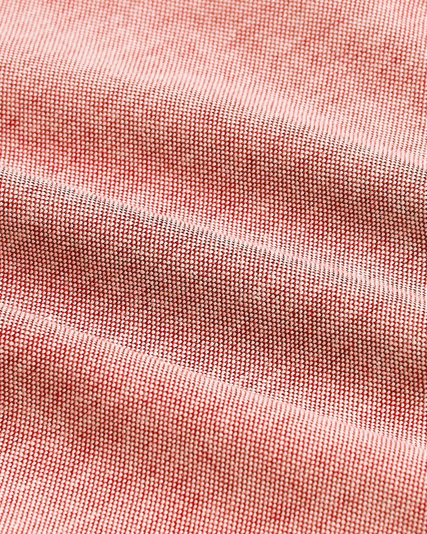 Peach Long Sleeve Oxford Shirt fabric close-up showing red and white threads.