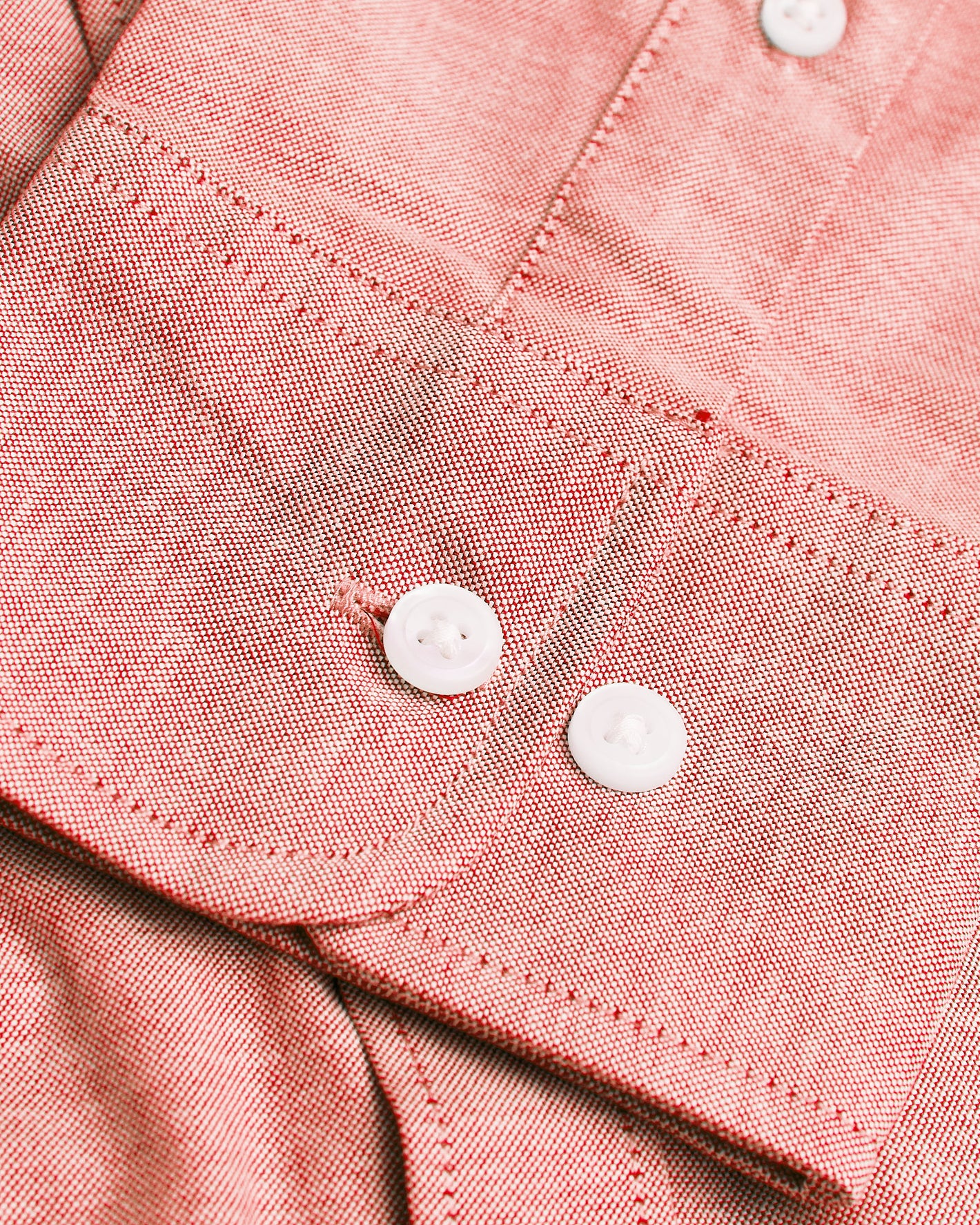Peach Long Sleeve Oxford Shirt cuff with white buttons and stitching.