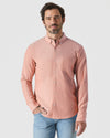 Model wearing Peach Long Sleeve Oxford Shirt with light-wash jeans.
