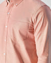 Peach Long Sleeve Oxford Shirt with front pocket and white buttons.