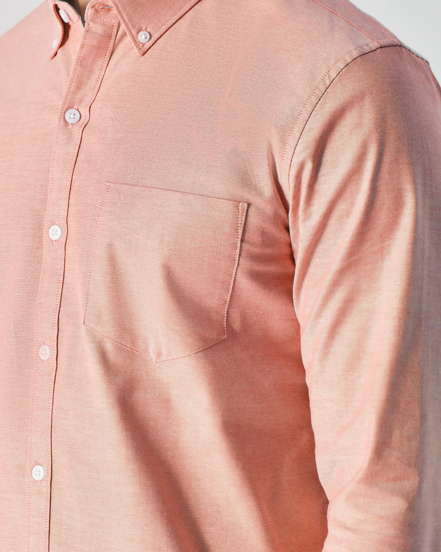 Peach Long Sleeve Oxford Shirt with front pocket and white buttons.
