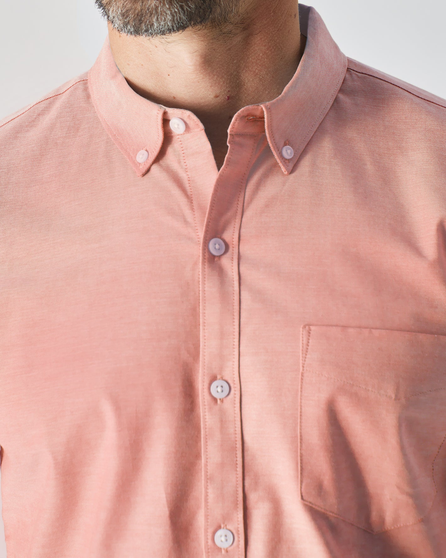 Man wearing Peach Long Sleeve Oxford Shirt with button-down collar.