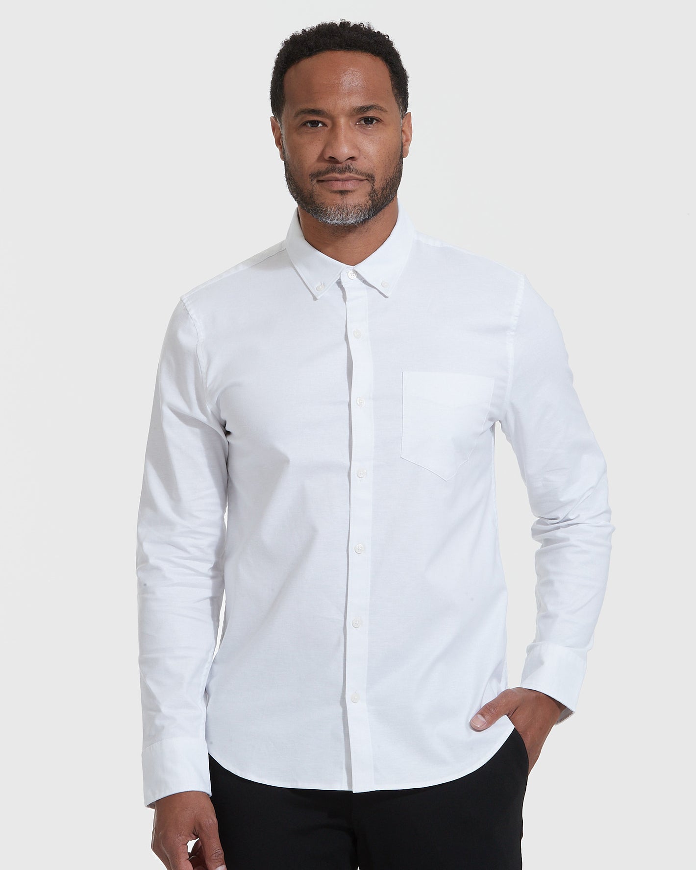 Model in white Standard Stretch Oxford shirt, slim fit.