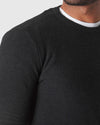 Man wearing Charcoal Heather Gray Pique Crew Sweater over a white tee.