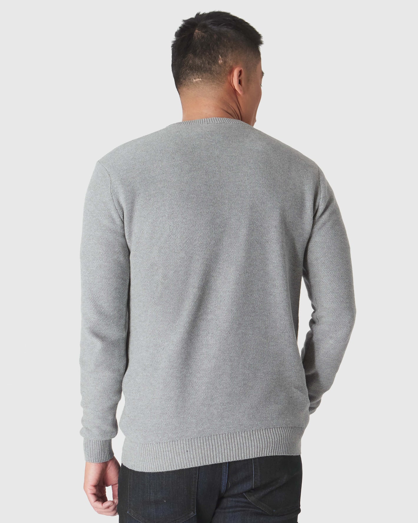 Heather Gray Pique Crew Sweater, back view, with dark jeans.