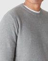 Heather Gray Pique Crew Sweater over white T-shirt, showing textured knit and slim fit.