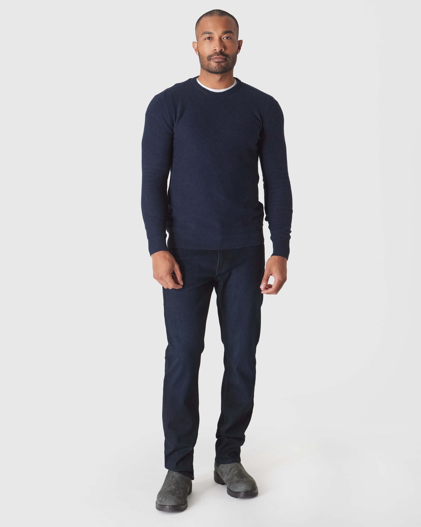 Heather Navy Pique Crew Sweater on man with relaxed posture.