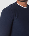 Heather Navy Pique Crew Sweater worn over a white T-shirt.