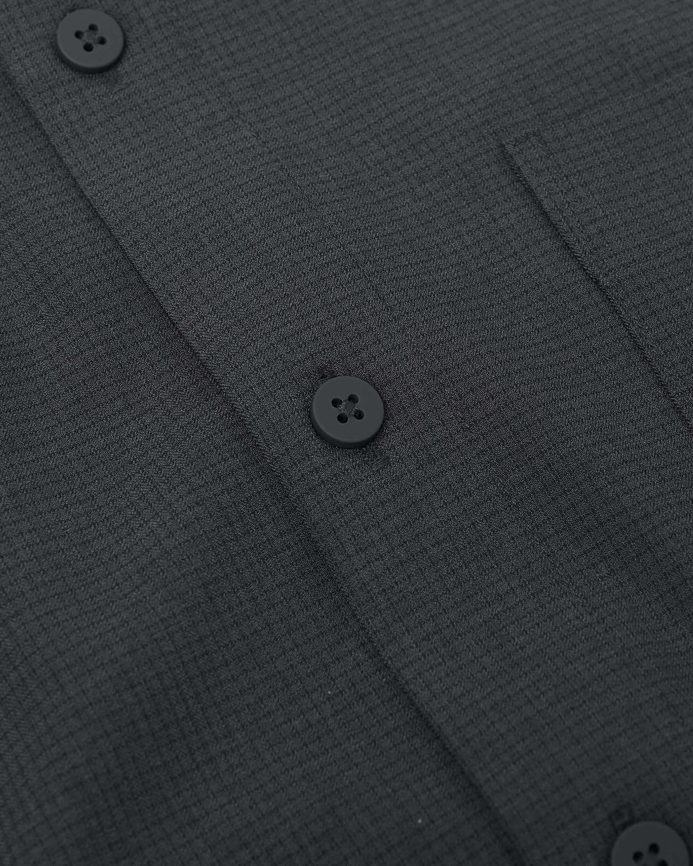 Close-up of Charcoal Heather Gray Long Sleeve Ripstop Commuter Shirt placket.
