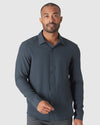 The Refined Ripstop Look: dark charcoal/teal button-front shirt.