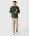 Man wearing Olive Long Sleeve Ripstop Commuter Shirt in relaxed pose.