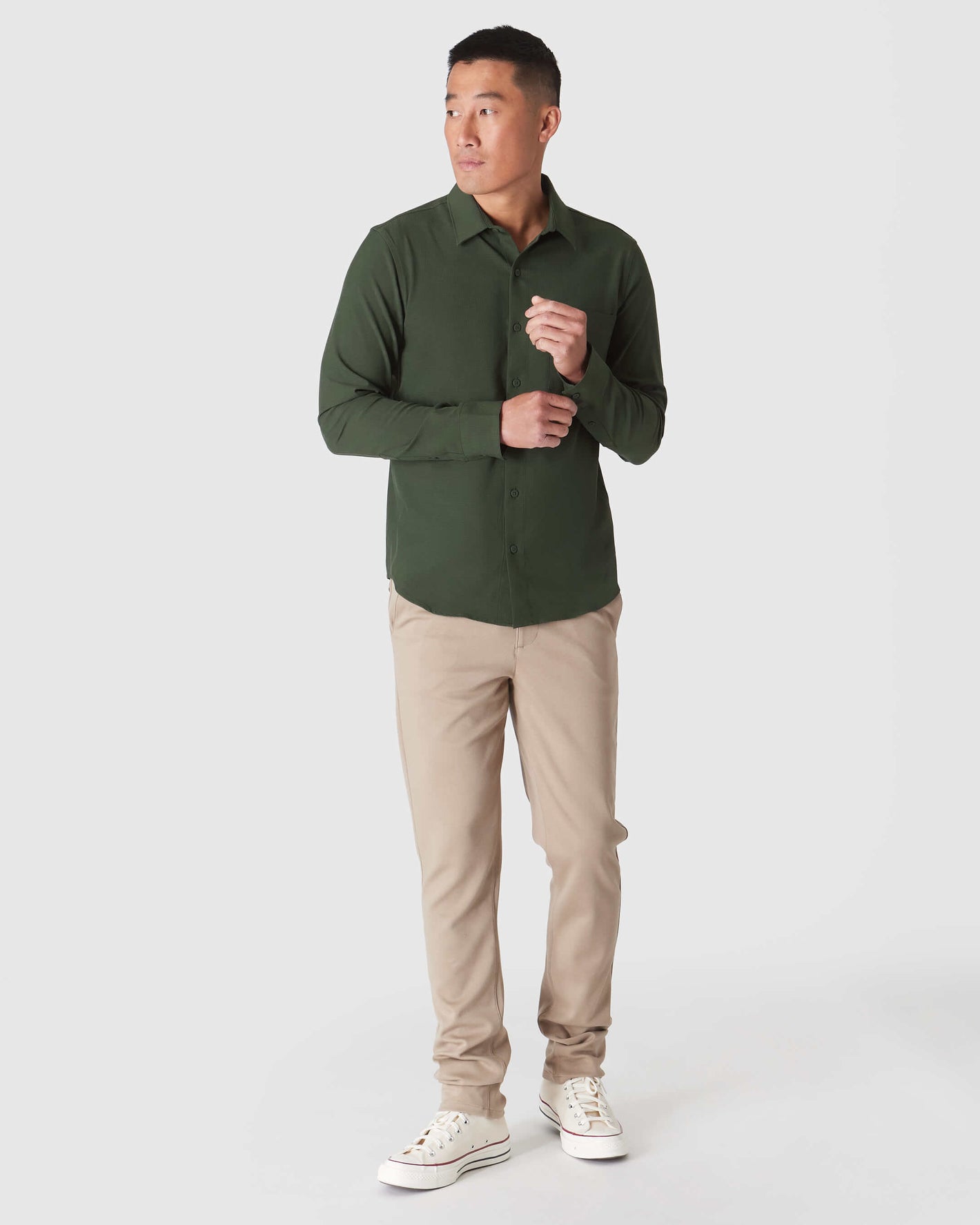 Man wearing Olive Long Sleeve Ripstop Commuter Shirt in relaxed pose.