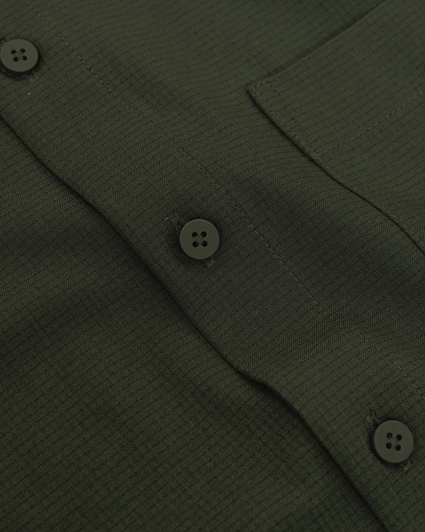 Olive Long Sleeve Ripstop Commuter Shirt with textured weave and chest pocket.