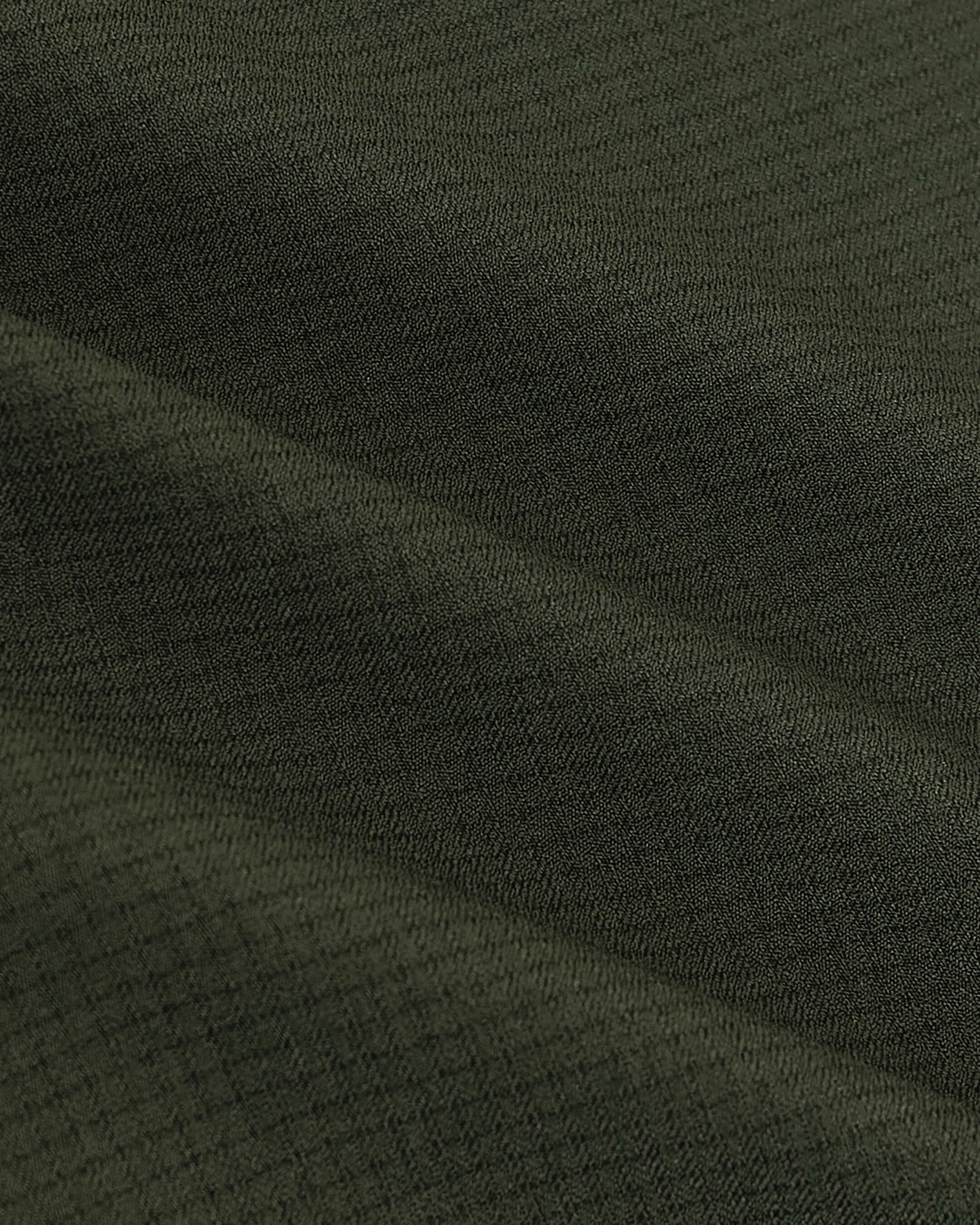 Olive Long Sleeve Ripstop Commuter Shirt fabric close-up, showcasing texture.