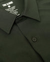 Olive Long Sleeve Ripstop Commuter Shirt with black buttons and collar.