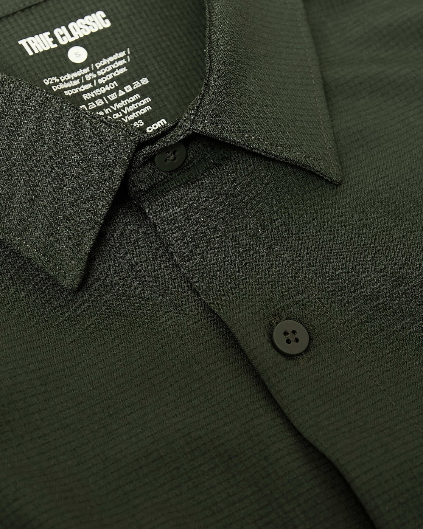Olive Long Sleeve Ripstop Commuter Shirt with black buttons and collar.