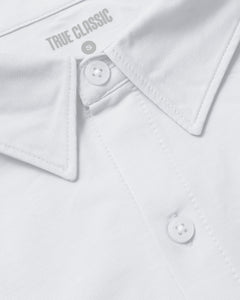 True ClassicWhite Stretch Long Sleeve Modern Knit Oxford close-up, featuring collar and stitching.