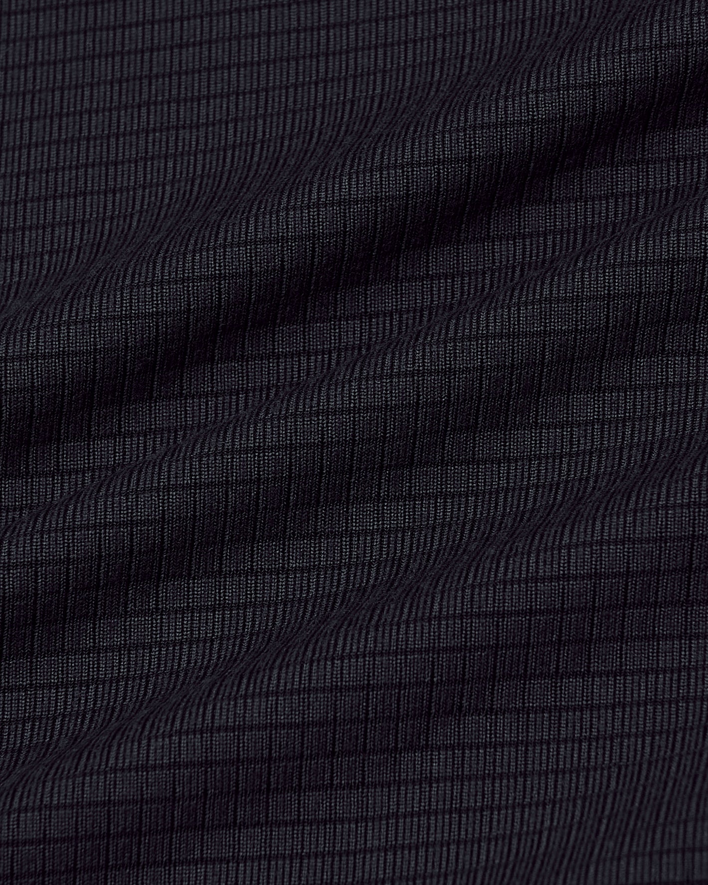 Black Long Sleeve Active Mesh Crew with ripstop texture and gentle fabric folds.