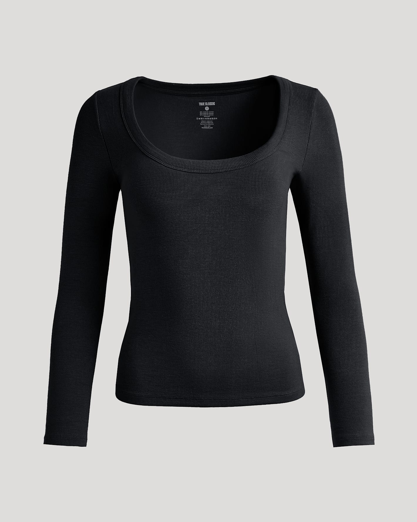 Womens Black Ribbed Long Sleeve Scoop Neck Tee against neutral backdrop.