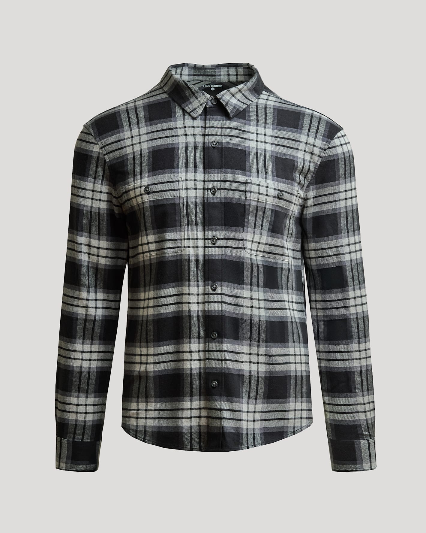 Onyx Plaid Long Sleeve Flannel Shirt with button front and pockets.
