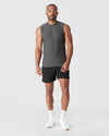 Man modeling Charcoal Heather Gray Active Sleeveless Muscle Tee with black shorts.