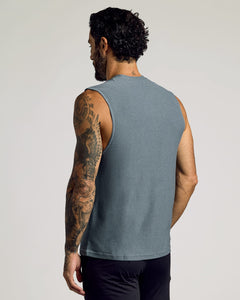 True ClassicMan wearing a heather navy sleeveless shirt showing back tattoos, displaying the Sleeveless Active Muscle Tee 3-Pack as a comfortable men's basics option.