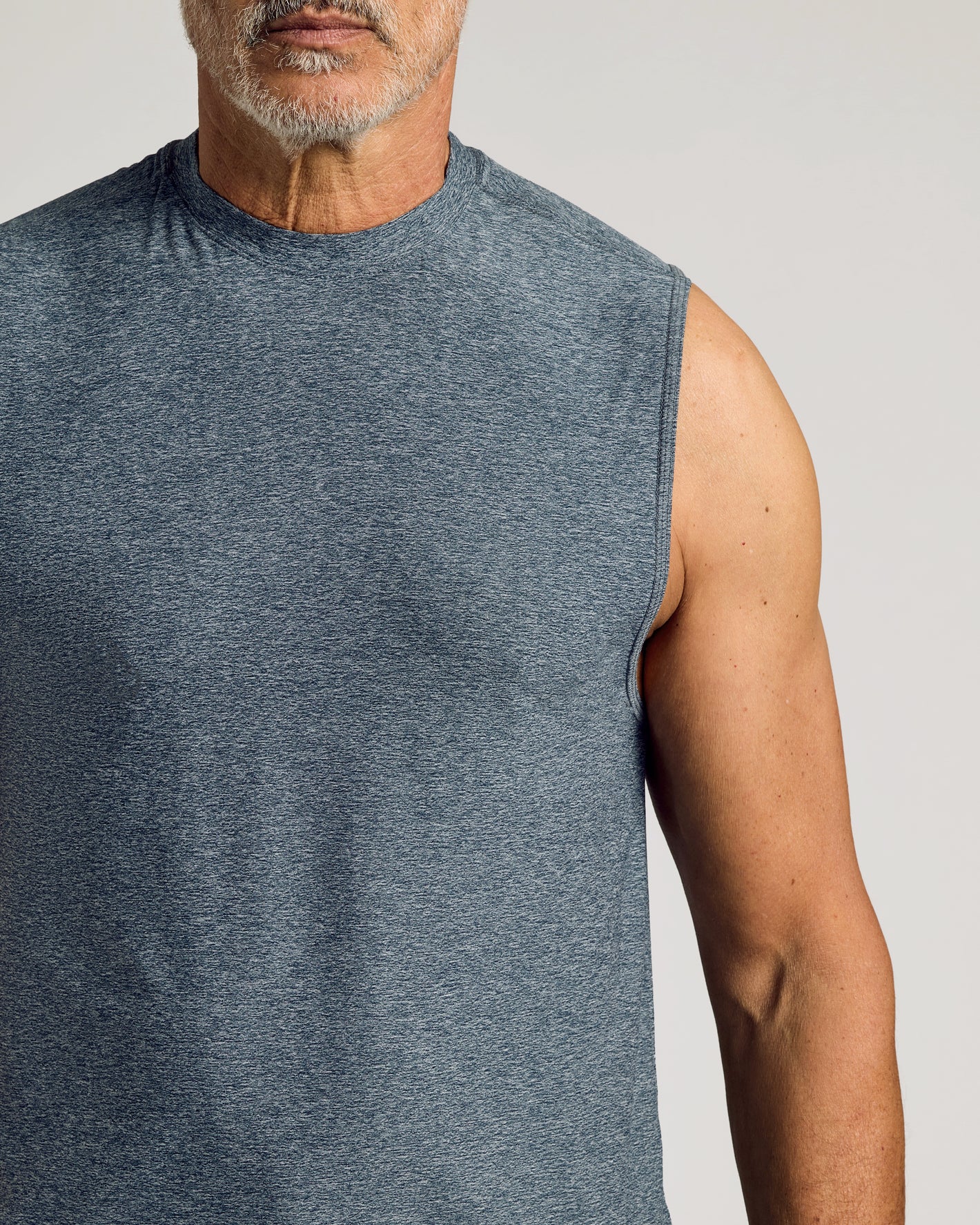 Heather Navy Sleeveless Active Muscle Tee showcasing a tanned, muscular arm.