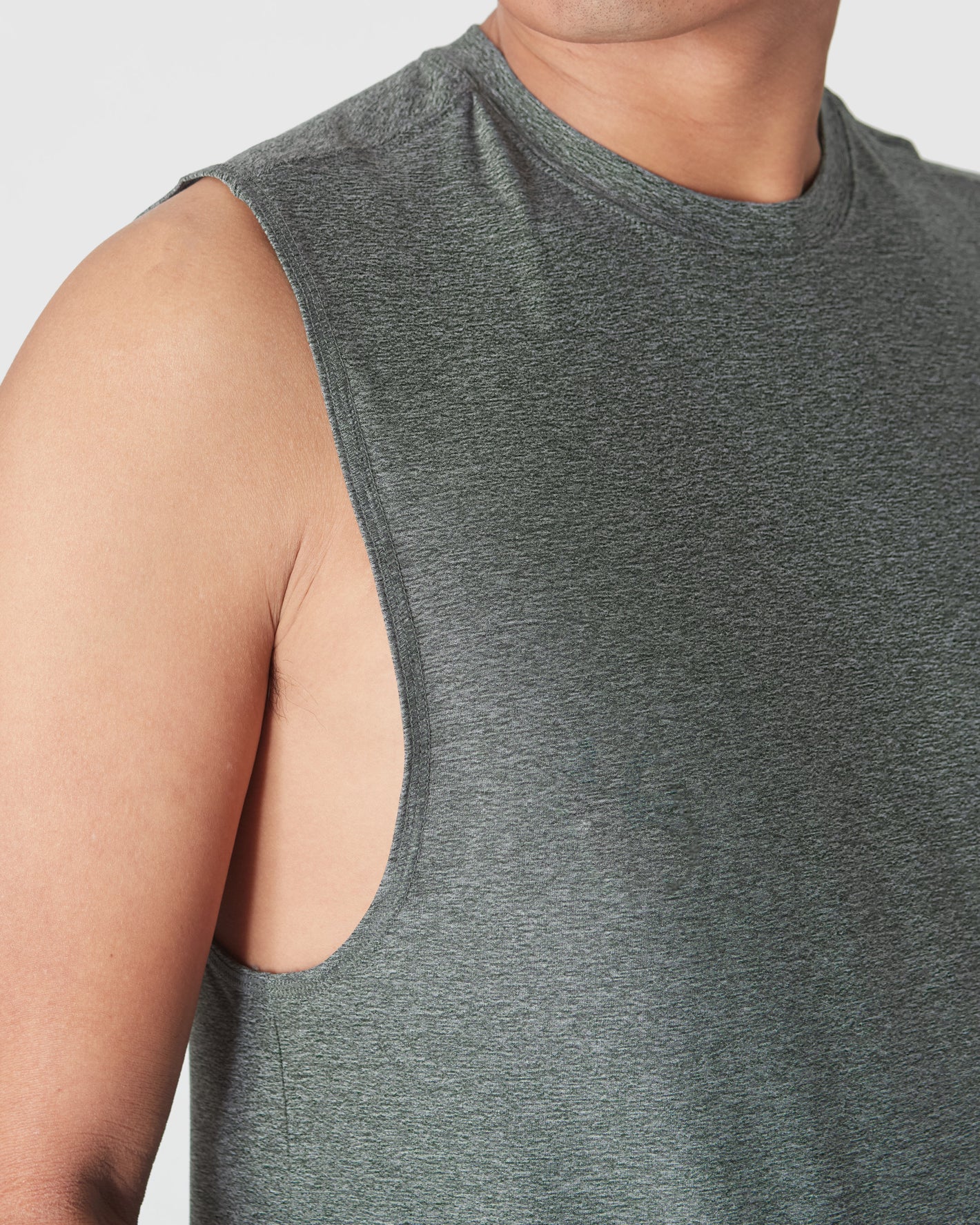 Heather Forest Sleeveless Active Muscle Tee showcasing armhole and neckline design.