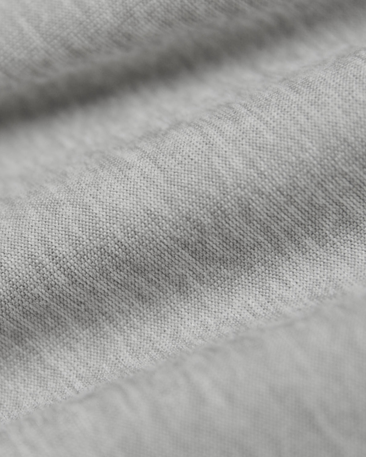 Light Heather Gray Active Sleeveless Muscle Tee, showcasing detailed weave and texture.