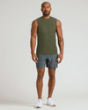 Model wearing Military Green Sleeveless Active Muscle Tee, paired with charcoal shorts.
