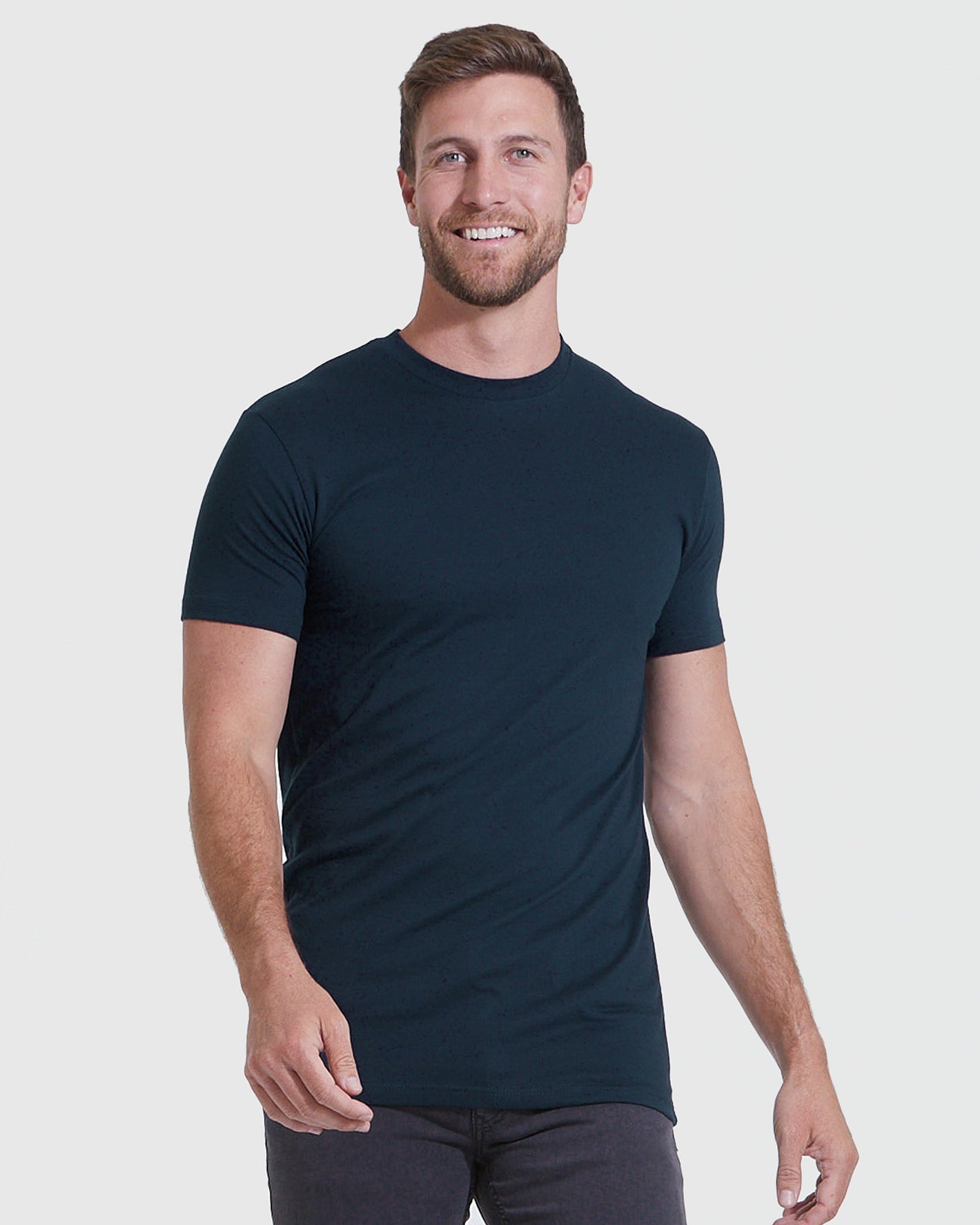 Man wearing Staple Tall Straight Hem T-Shirt, studio shot.