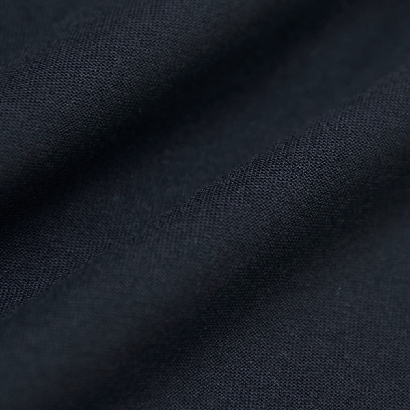 Navy Tall Active Crew Neck 2.0, dark woven fabric, soft folds.