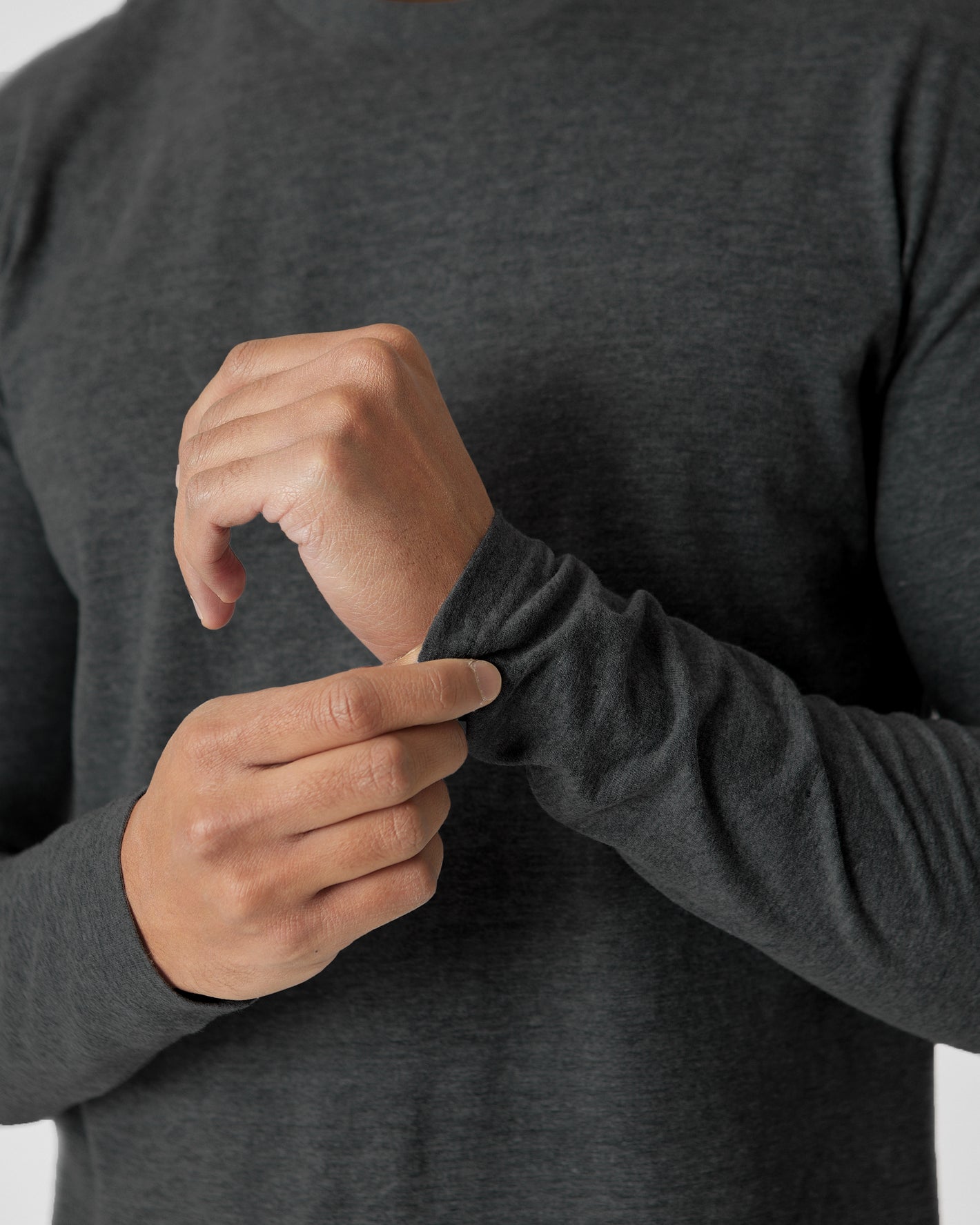 Adjusting cuff of Charcoal Heather Gray Tall Long Sleeve T-Shirt.