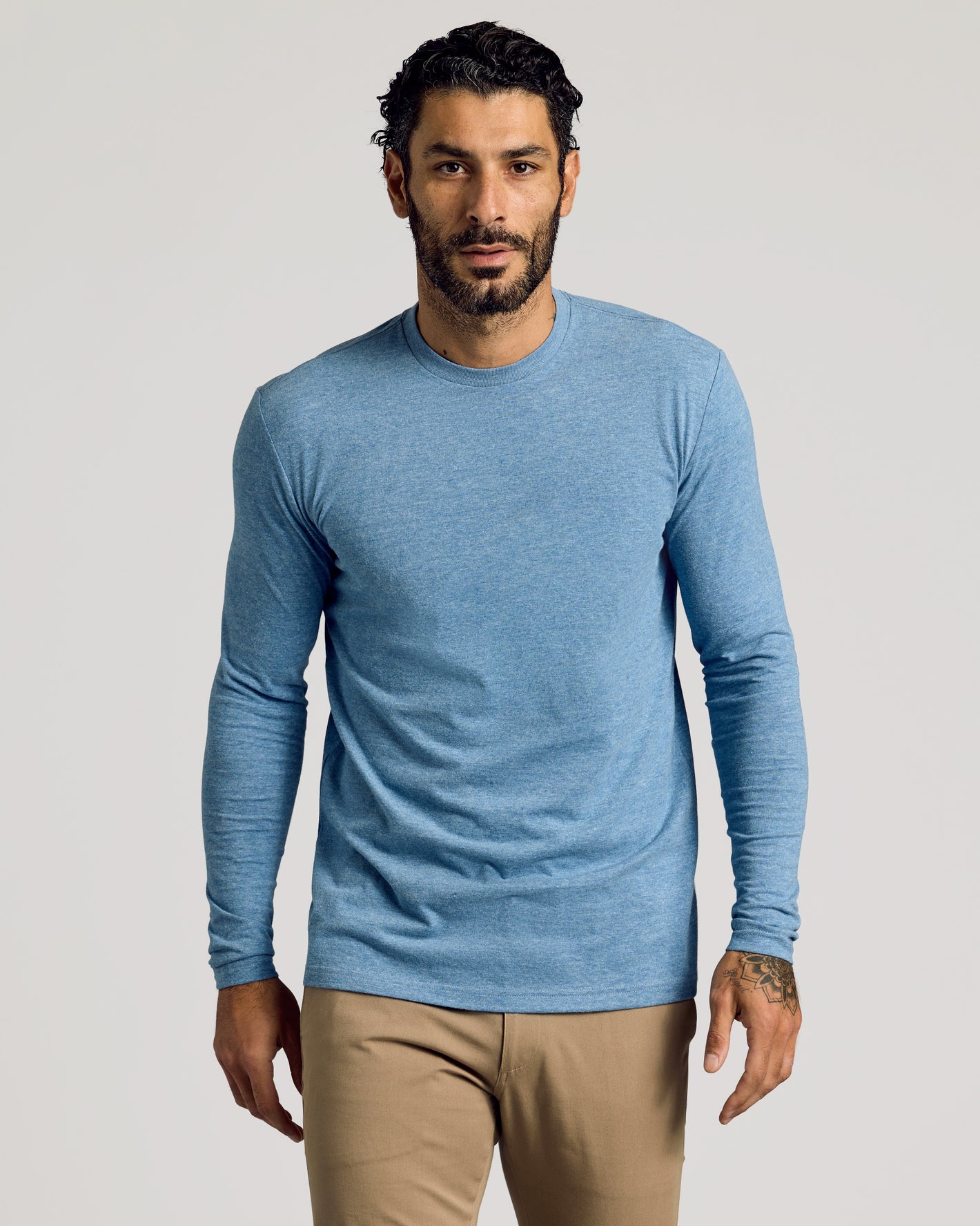 Heather Indigo Tall Long Sleeve T-Shirt with khaki pants, tattoo visible.