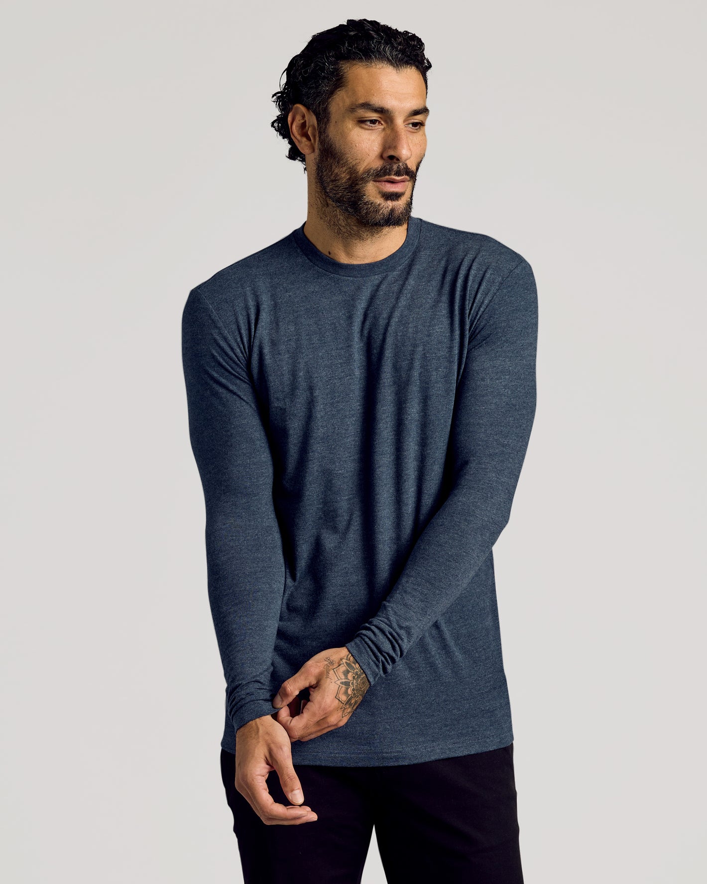 Man in Staple Tall Long Sleeve T-Shirt, showcasing fit and tattoo.
