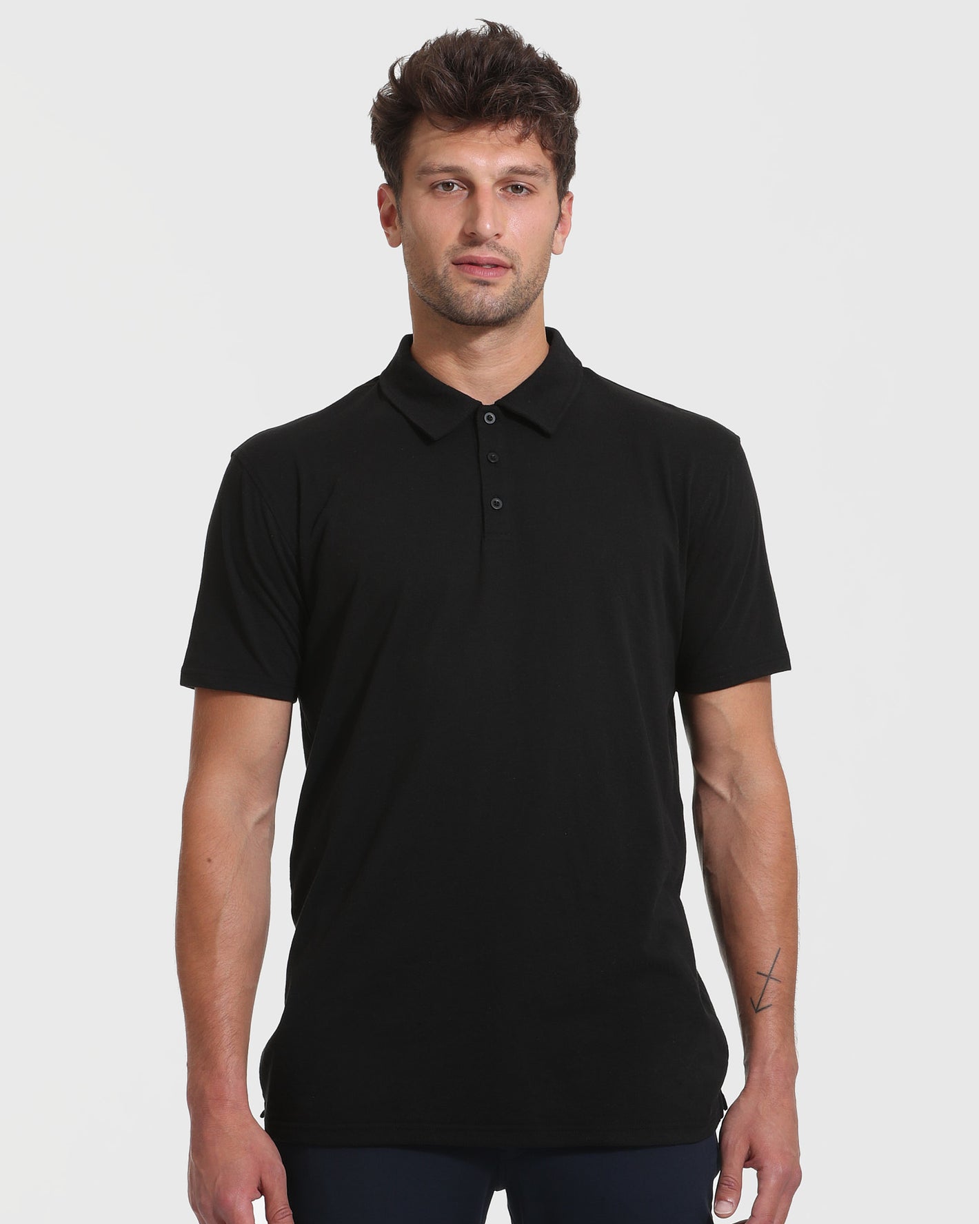 Man wearing Black & White Tall Classic Polo 6-Pack, showcasing fit and style.