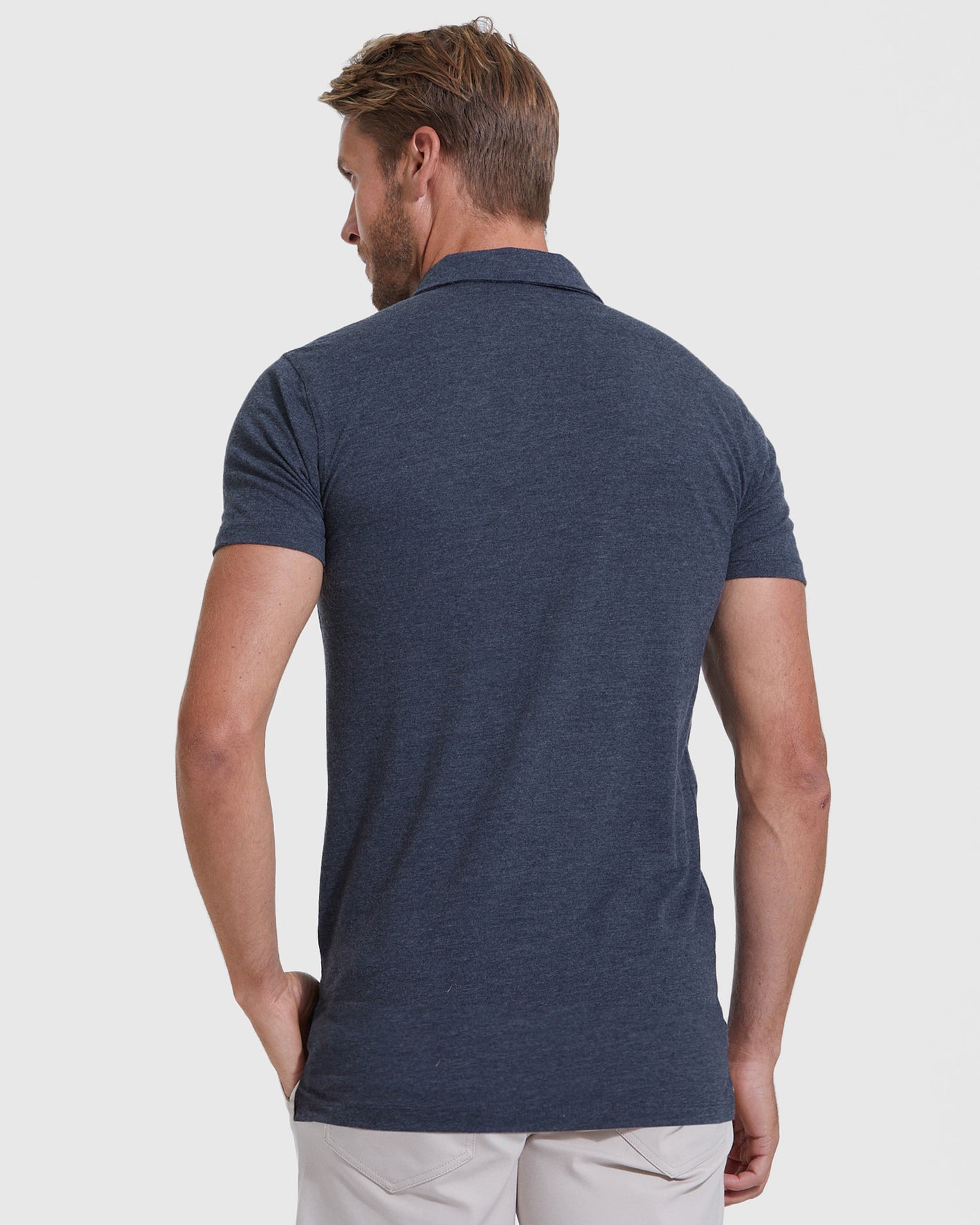 Heather Navy Short Sleeve Tall Polo on man, highlighting fit and comfort.