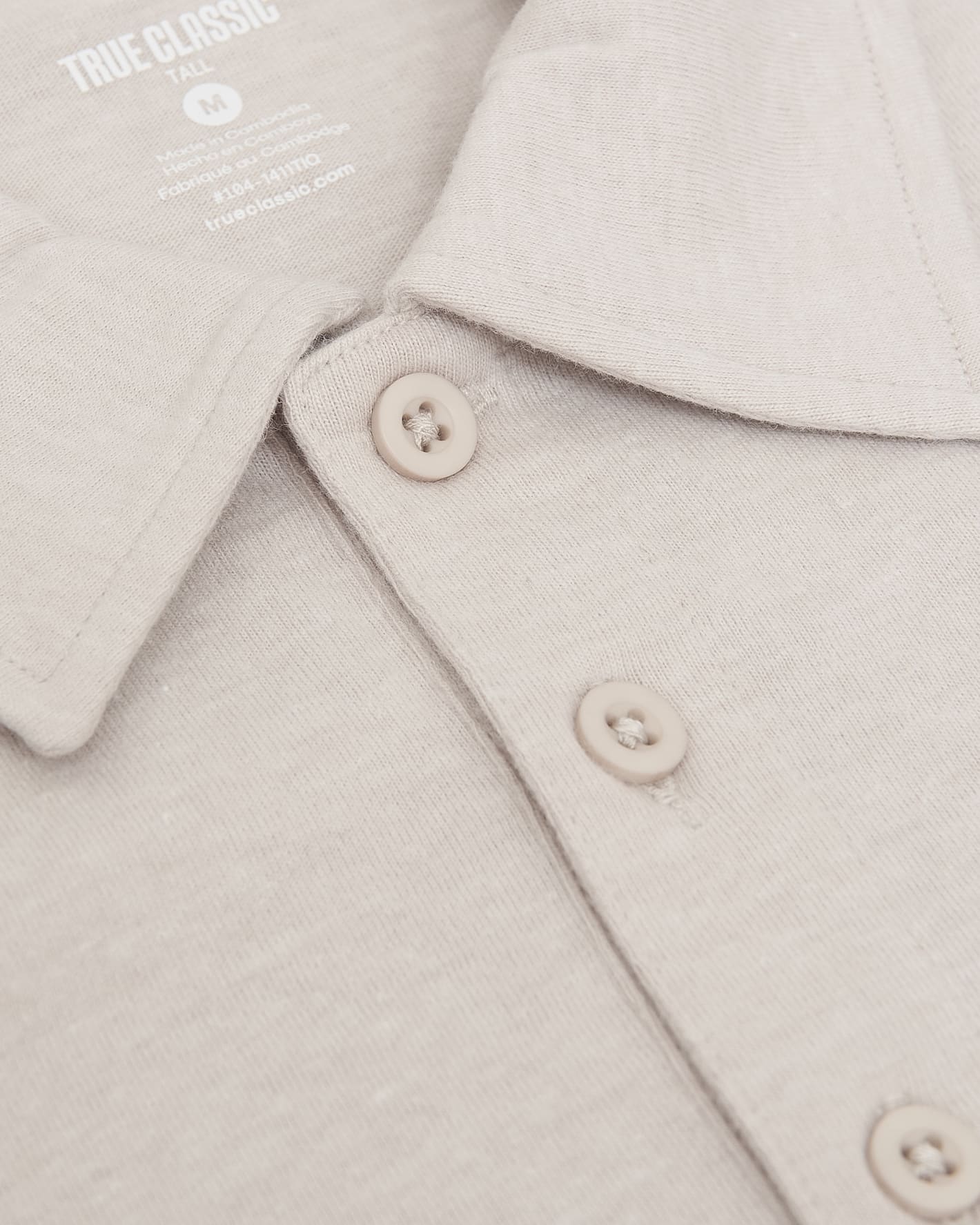 Oatmeal Short Sleeve Tall Polo close-up showing collar and buttons.