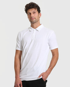 True ClassicYoung man in All White Tall Classic Polo, hands in pocket.