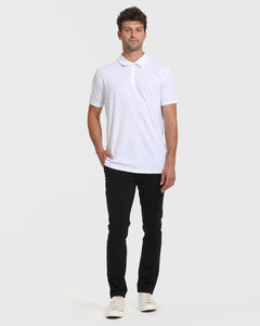 True ClassicMan wearing All White Tall Classic Polo with black pants and sneakers.