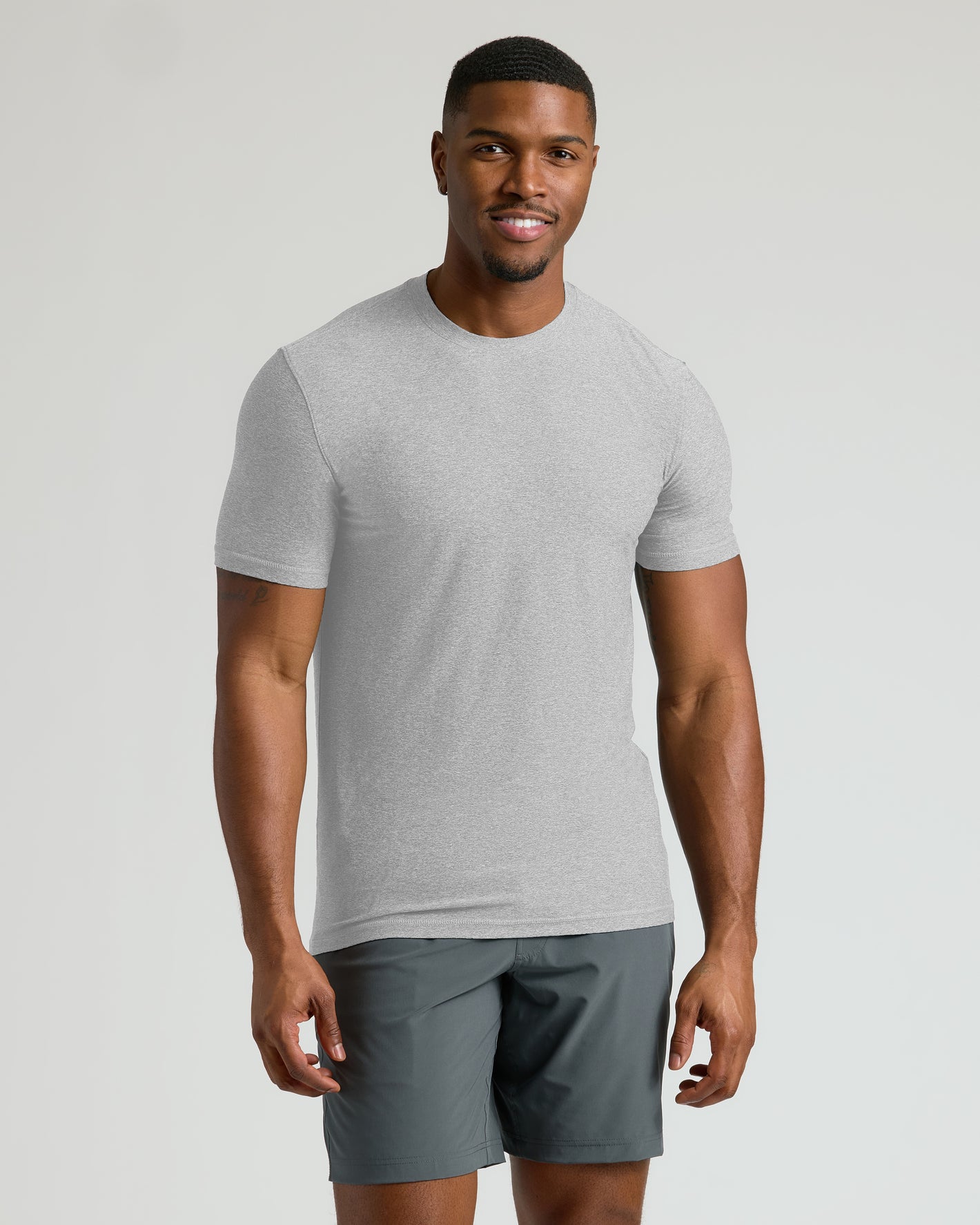 Light Heather Gray Tall Active Crew Neck 2.0 on smiling male model.