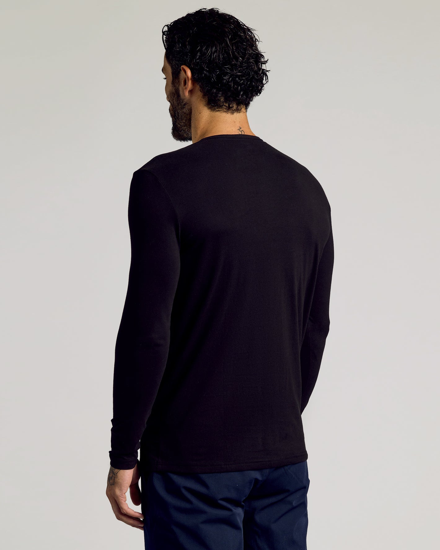 Black Tall Classic Long Sleeve Henley on man, showcasing fit and length.