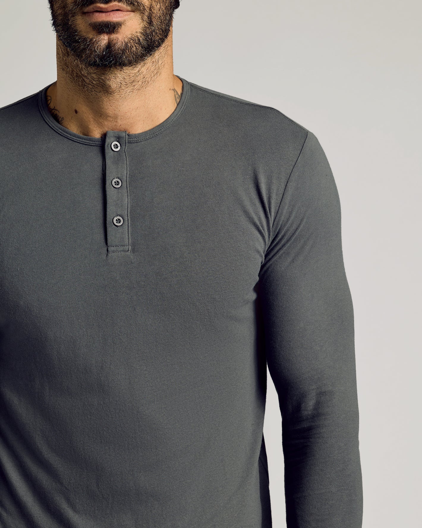Carbon Tall Classic Long Sleeve Henley on bearded man with tattoos.