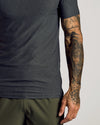 Charcoal Heather Gray Short Sleeve Tall Active Polo worn by tattooed arm.